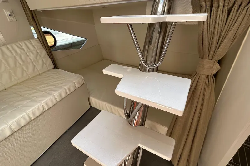 Slide: The Image of Interior of 2021 Evolve 360HT yacht with modern seating and sleek staircase design. - 72