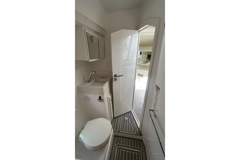 Slide: The Image of Compact bathroom in 2021 Evolve 360HT with toilet, sink, and mirror. - 74