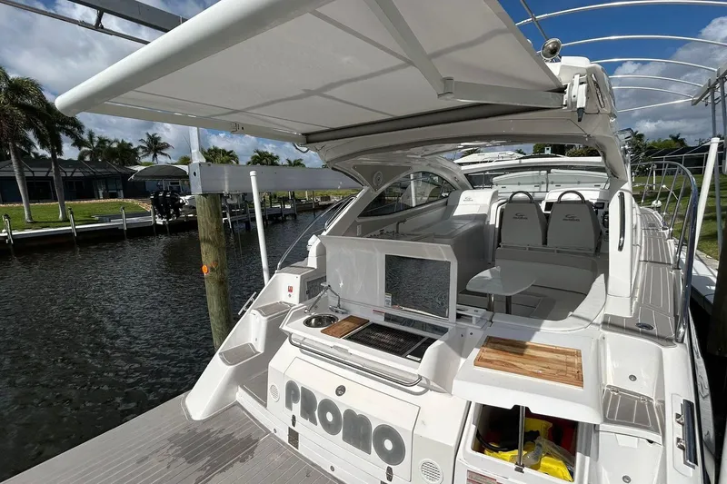 Slide: The Image of Luxury Evolve 360HT yacht docked, featuring spacious deck and modern amenities, 2021 model. - 87