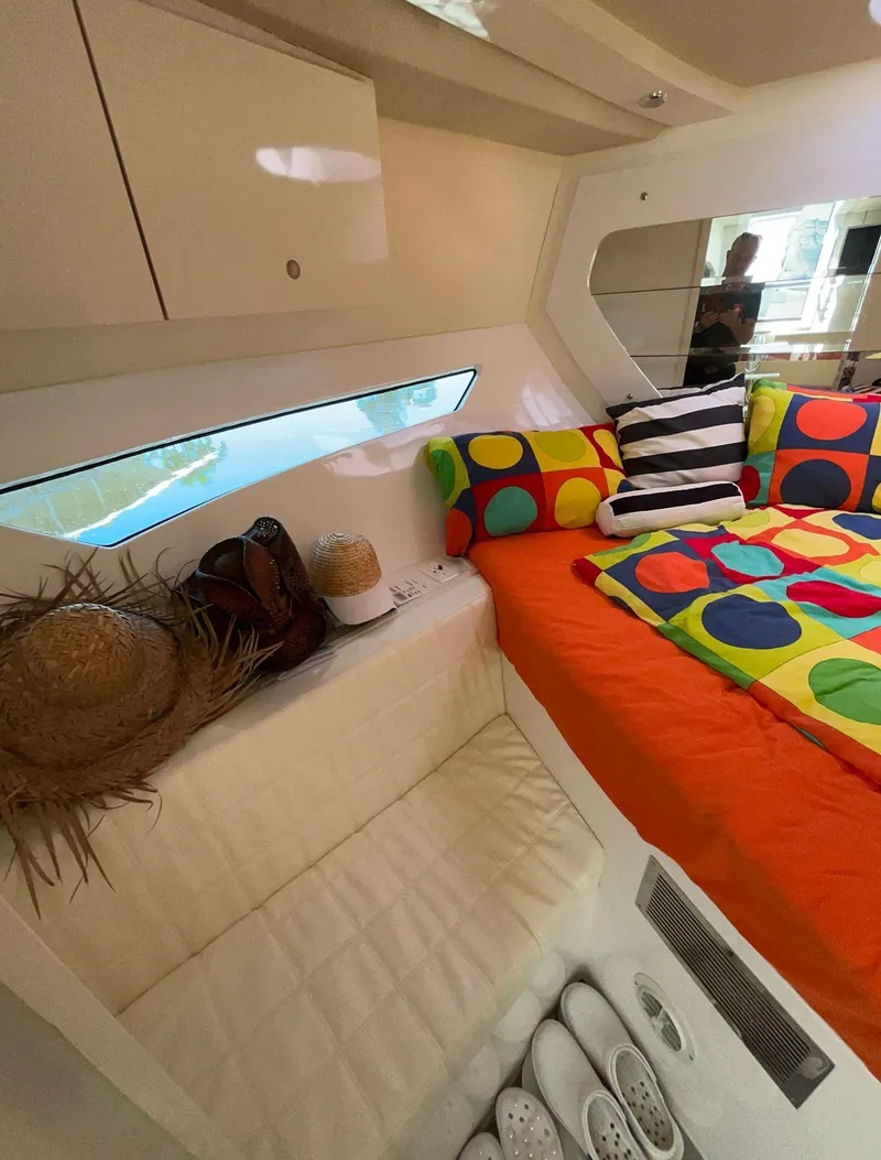 Slide: The Image of Interior of 2022 Evolve 360HT yacht with colorful bedding and modern design. - 39