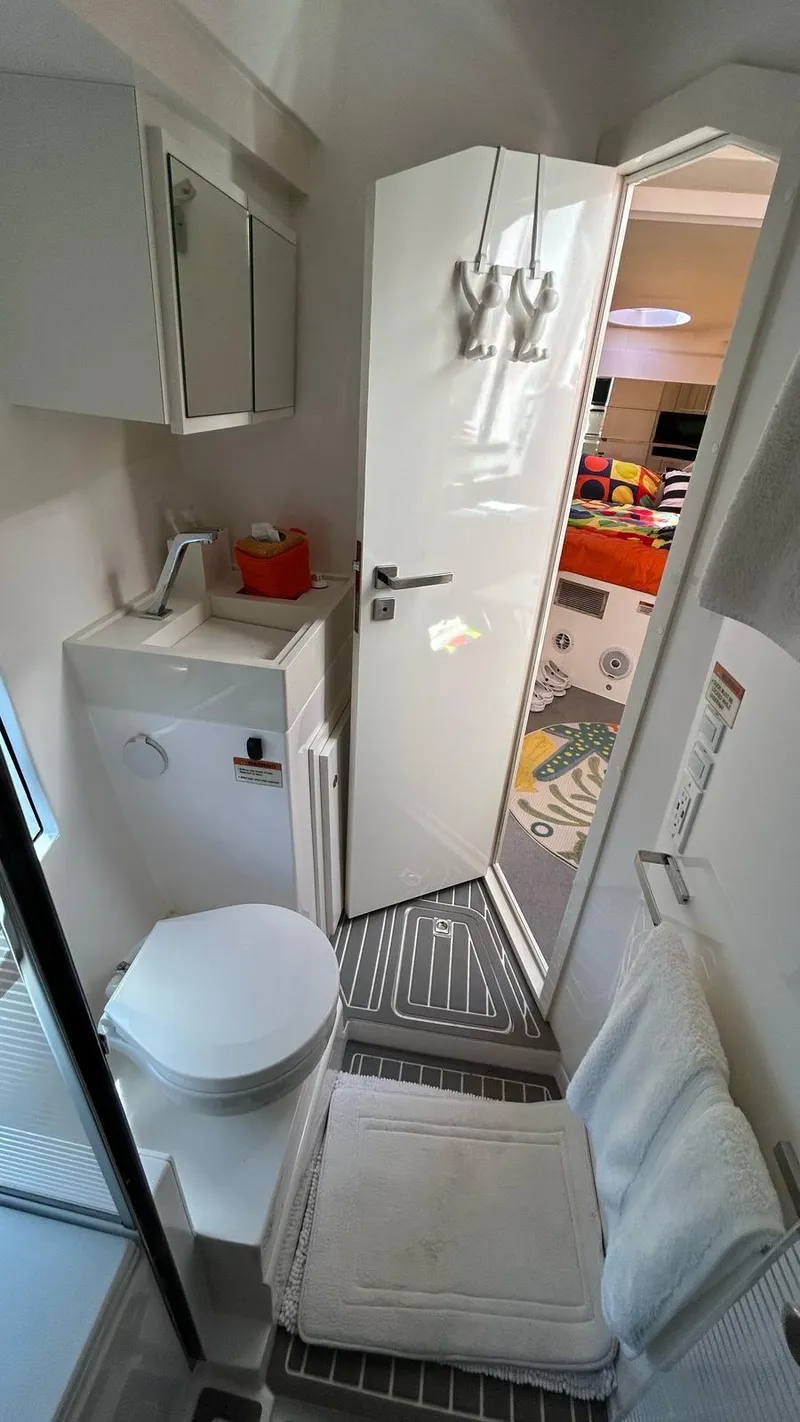 Slide: The Image of Compact bathroom in 2022 Evolve 360HT RV with modern amenities and sleek design. - 41