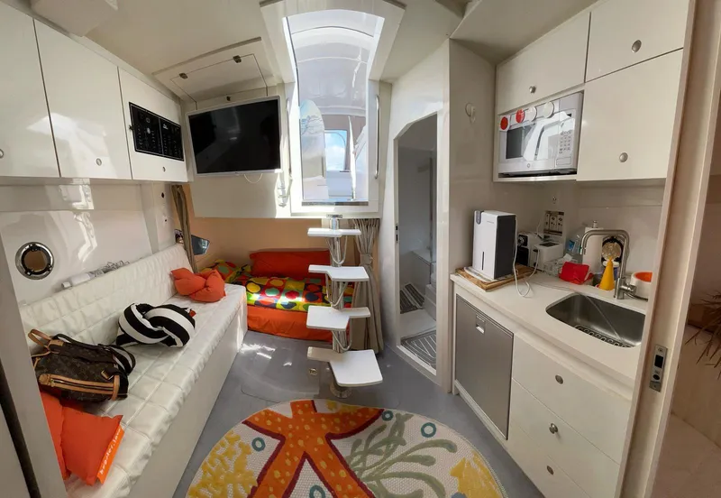 Slide: The Image of Modern interior of 2022 Evolve 360HT camper with kitchen, seating, and colorful decor. - 44