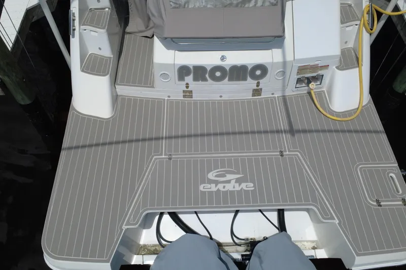 Slide: The Image of 2022 Evolve 360HT boat deck with gray non-slip surface and logo. - 50