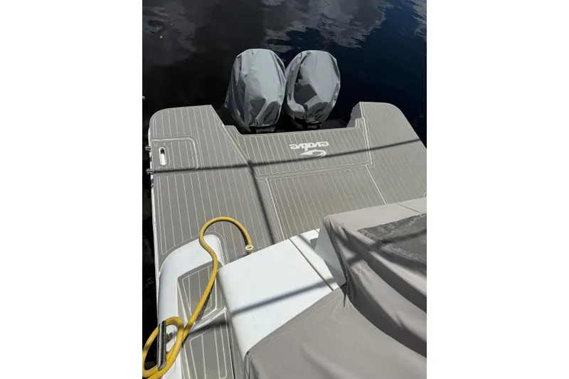 Slide: The Image of Evolve 360HT 2022 boat deck with covered engines and mooring line. - 55