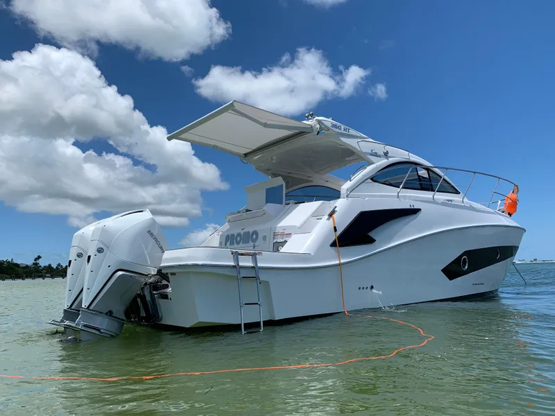 Slide: The Image of 2022 Evolve 360HT boat on water under clear blue sky. - 9