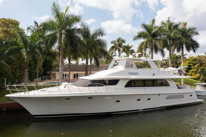 The Image of 2004 Cheoy Lee 84 Bravo Flybridge yacht docked near palm trees. - 0
