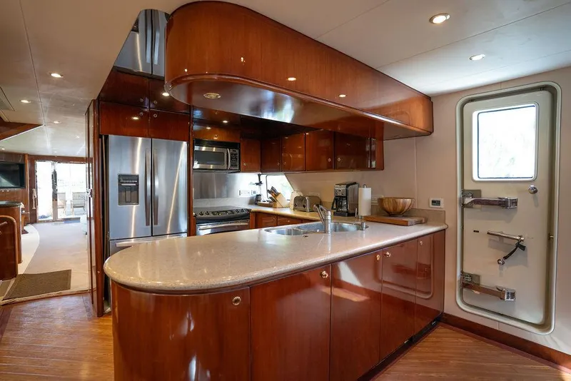 Slide: The Image of Luxurious kitchen interior of 2004 Cheoy Lee 84 Bravo Flybridge yacht with modern appliances. - 10