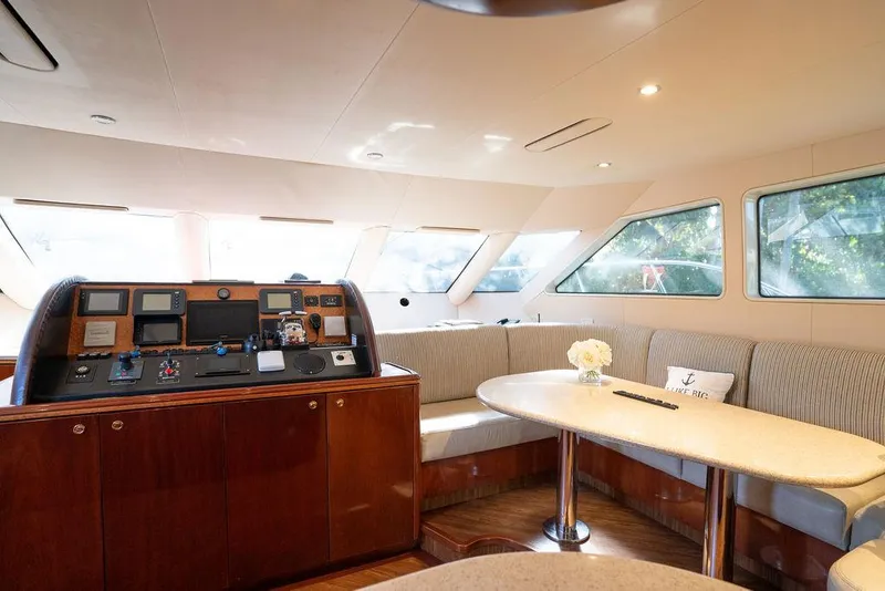 Slide: The Image of Luxurious interior of 2004 Cheoy Lee 84 Bravo Flybridge yacht with elegant seating and helm. - 14