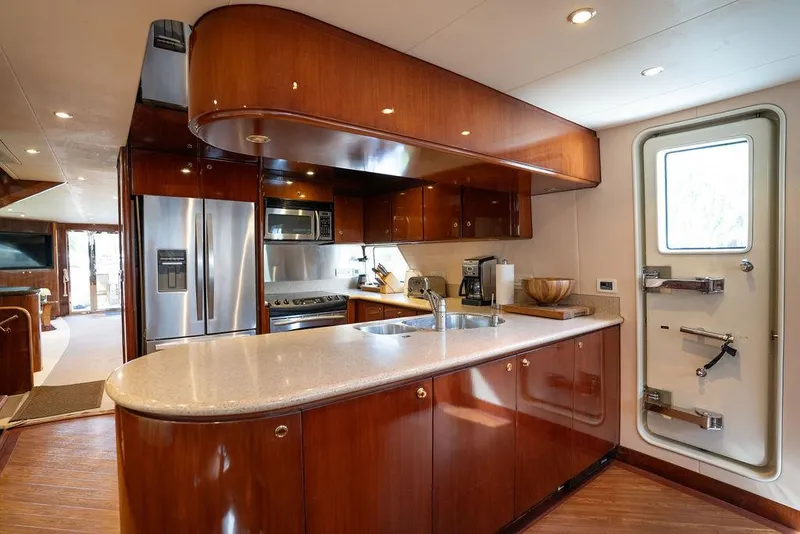 Slide: The Image of Luxurious kitchen interior of 2004 Cheoy Lee 84 Bravo Flybridge yacht with modern amenities. - 15