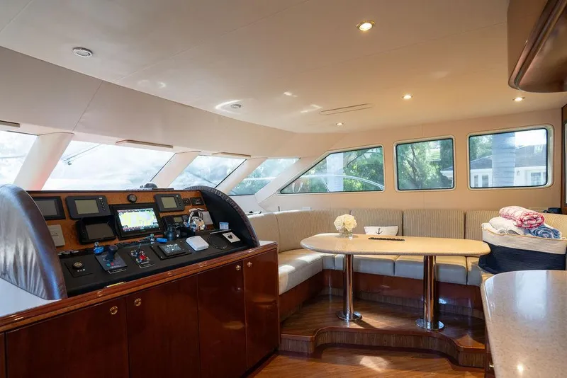 Slide: The Image of Luxurious interior of 2004 Cheoy Lee 84 Bravo Flybridge yacht with helm and seating area. - 16