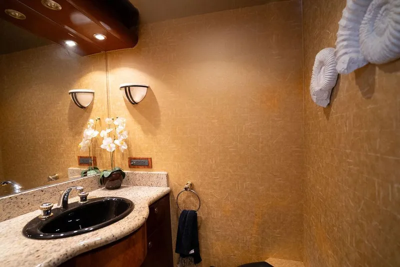 Slide: The Image of Luxurious bathroom interior on 2004 Cheoy Lee 84 Bravo Flybridge yacht, featuring elegant fixtures. - 18