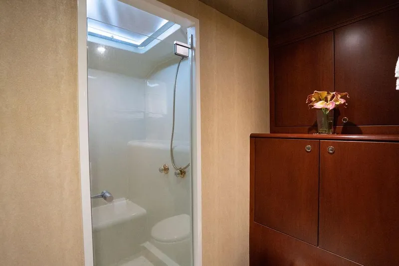 Slide: The Image of Luxurious bathroom in 2004 Cheoy Lee 84 Bravo Flybridge yacht with elegant wood cabinetry. - 21