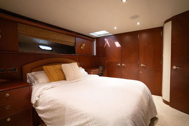 Slide: The Image of Luxurious bedroom in 2004 Cheoy Lee 84 Bravo Flybridge yacht with elegant wood finishes. - 24