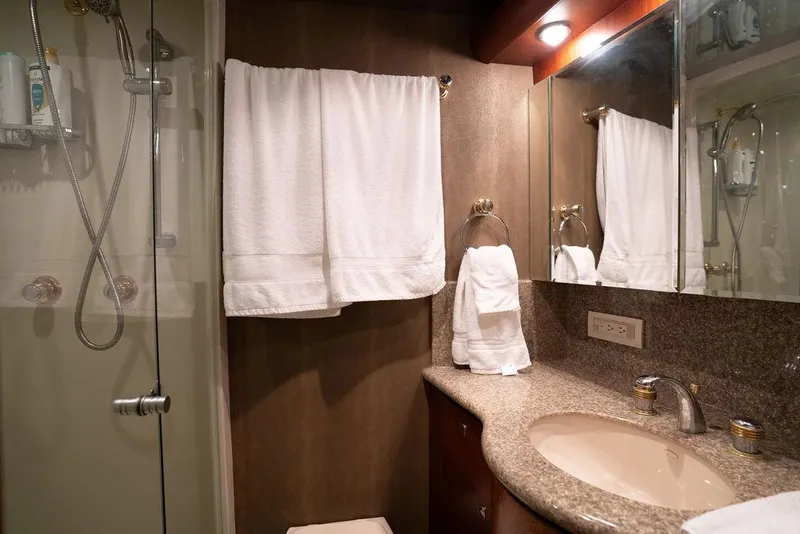 Slide: The Image of Luxurious bathroom in 2004 Cheoy Lee 84 Bravo Flybridge yacht with elegant fixtures. - 27
