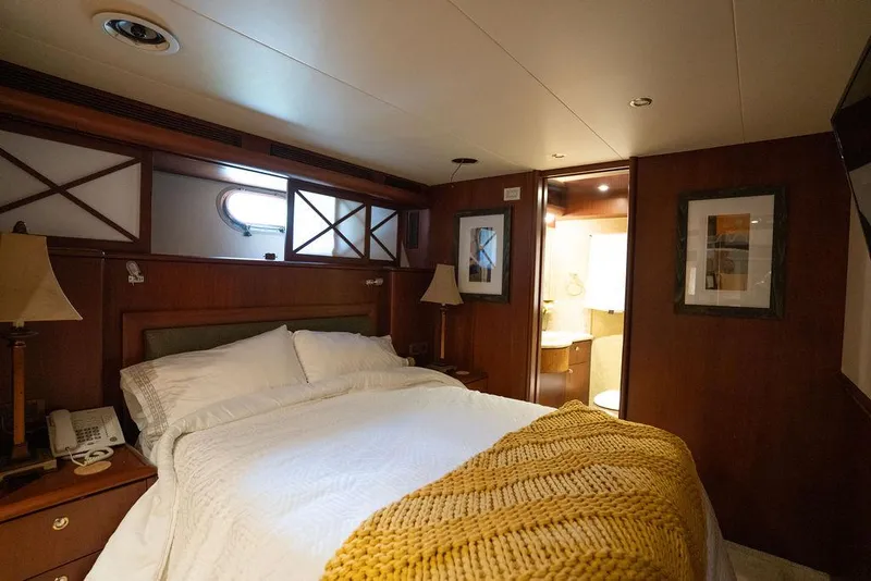 Slide: The Image of Luxurious bedroom in 2004 Cheoy Lee 84 Bravo Flybridge yacht with cozy decor. - 28