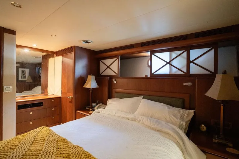 Slide: The Image of Luxurious bedroom interior of 2004 Cheoy Lee 84 Bravo Flybridge yacht with elegant wood finishes. - 29