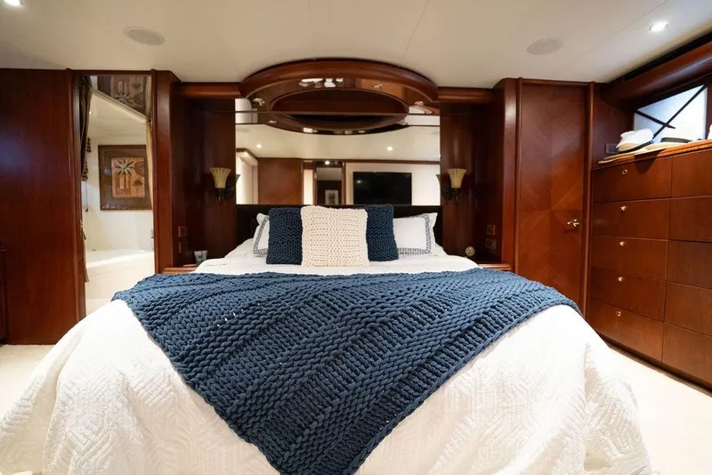 Slide: The Image of Luxurious bedroom in 2004 Cheoy Lee 84 Bravo Flybridge yacht with elegant wood paneling. - 31