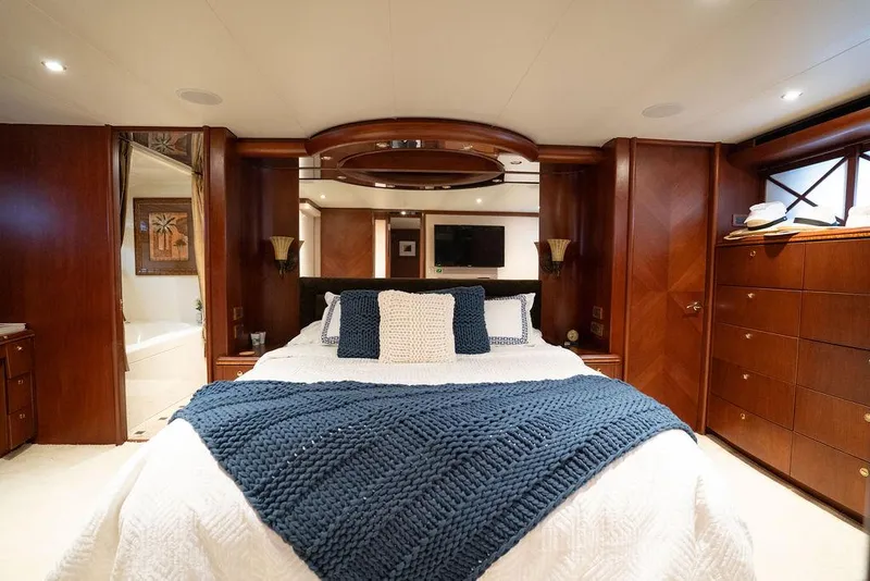 Slide: The Image of Luxurious bedroom in 2004 Cheoy Lee 84 Bravo Flybridge yacht with elegant wood finishes. - 32