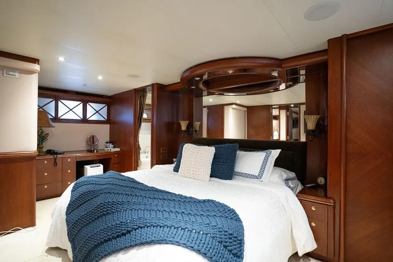 Slide: The Image of Luxurious bedroom interior of 2004 Cheoy Lee 84 Bravo Flybridge yacht with elegant wood finishes. - 33