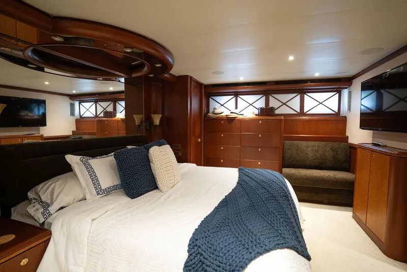Slide: The Image of Luxurious bedroom in 2004 Cheoy Lee 84 Bravo Flybridge yacht with elegant wood finishes. - 34