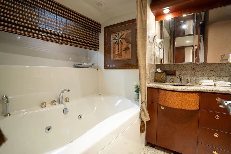 Slide: The Image of Luxurious bathroom in 2004 Cheoy Lee 84 Bravo Flybridge yacht with jacuzzi tub and elegant decor. - 35