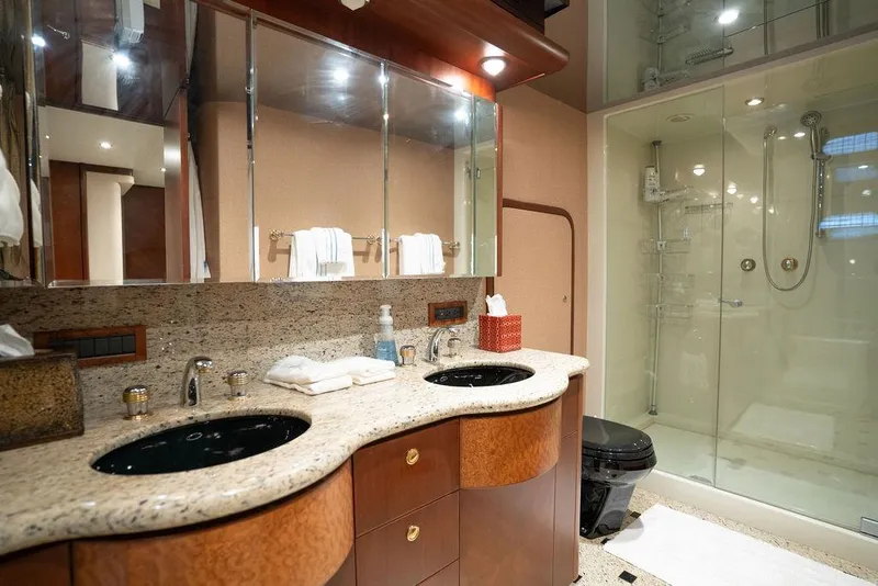 Slide: The Image of Luxurious bathroom in 2004 Cheoy Lee 84 Bravo Flybridge yacht with dual sinks and glass shower. - 36