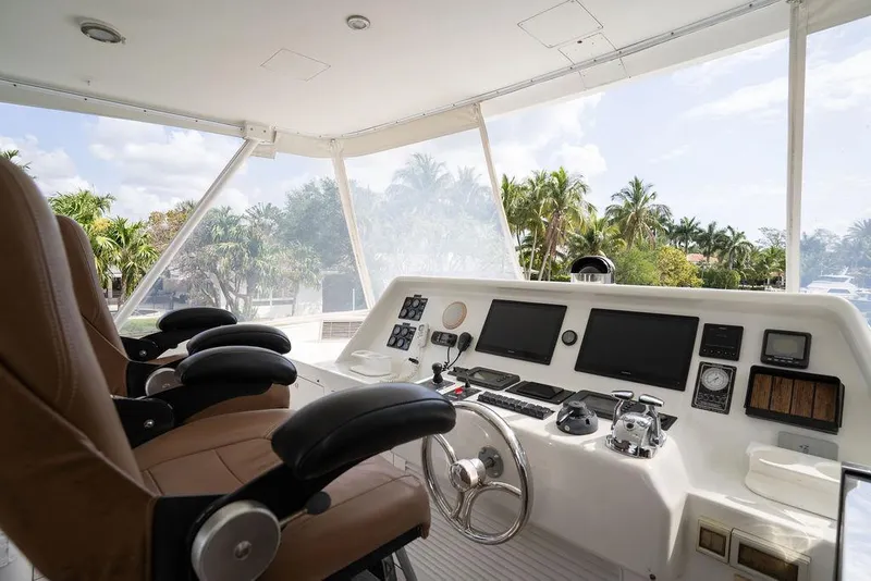 Slide: The Image of Flybridge helm of 2004 Cheoy Lee 84 Bravo yacht with dual seats and navigation equipment. - 46