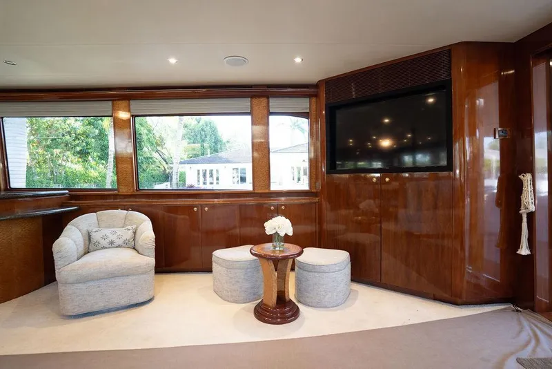 Slide: The Image of Luxurious interior of 2004 Cheoy Lee 84 Bravo Flybridge yacht with elegant seating and large windows. - 5