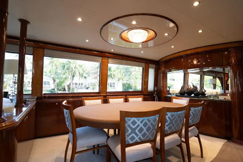 Slide: The Image of Luxurious dining area in 2004 Cheoy Lee 84 Bravo Flybridge yacht with elegant wood finishes. - 6
