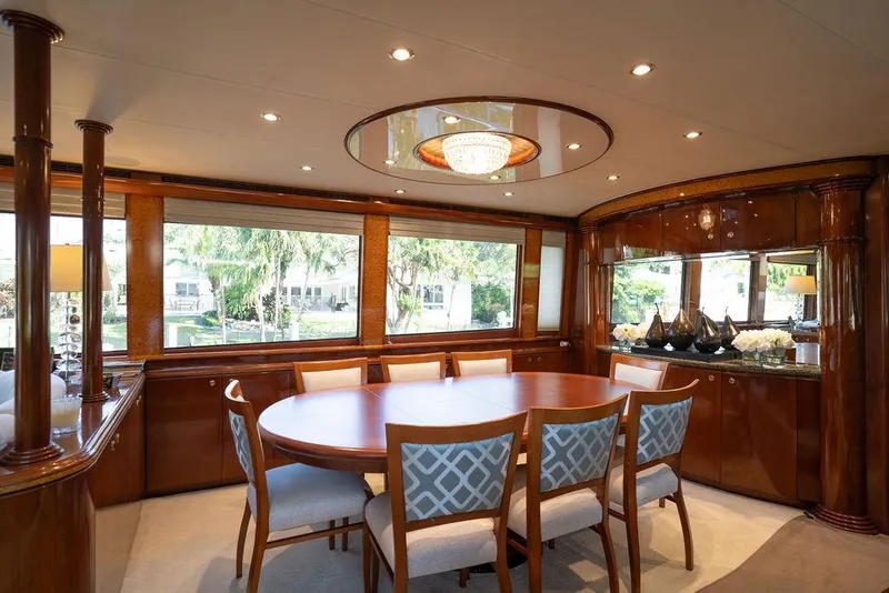 Slide: The Image of Luxurious dining area on 2004 Cheoy Lee 84 Bravo Flybridge yacht with elegant wood finishes. - 9