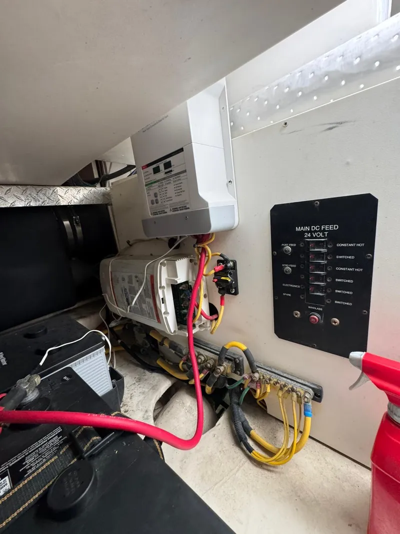 Slide: The Image of 2007 Luhrs 41 Express engine room with electrical panel and wiring. - 22