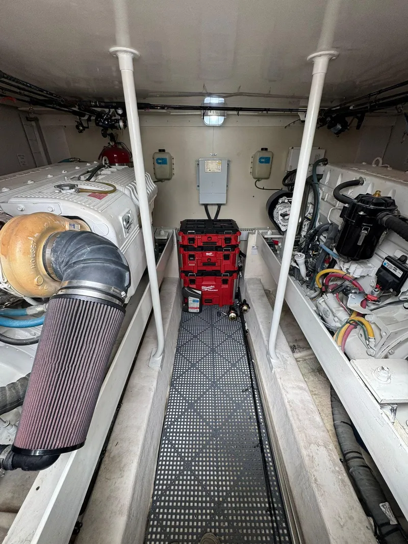 Slide: The Image of Engine room of 2007 Luhrs 41 Express boat, featuring dual engines and central equipment. - 23