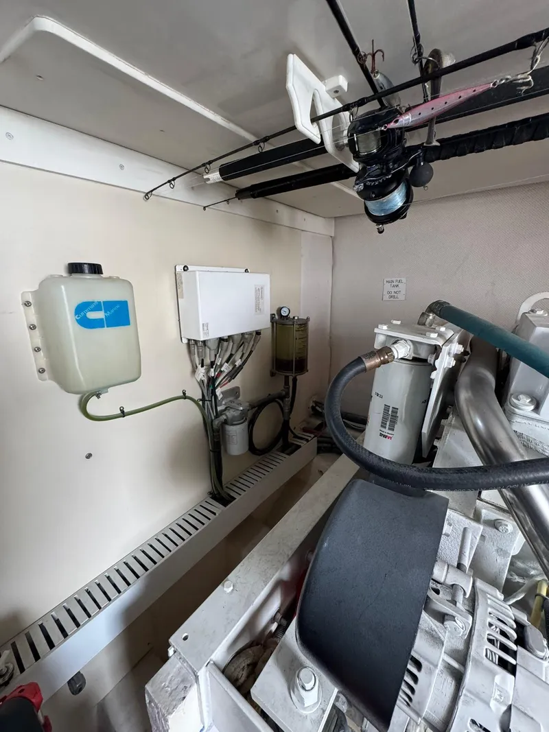 Slide: The Image of Engine room of 2007 Luhrs 41 Express boat, showcasing mechanical components and systems. - 28