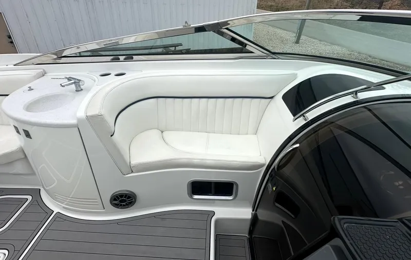 Slide: The Image of Luxury seating area on a 2005 Cobalt 360 boat with sleek white upholstery. - 11