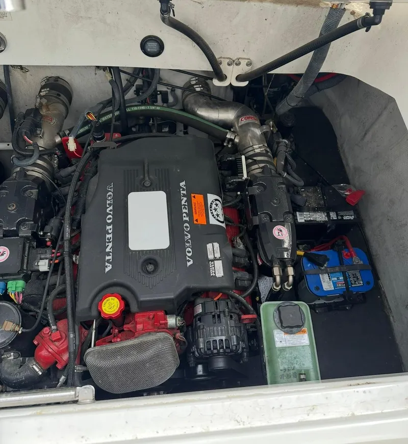 Slide: The Image of Engine compartment of a 2005 Cobalt 360 boat with Volvo Penta engine components. - 16
