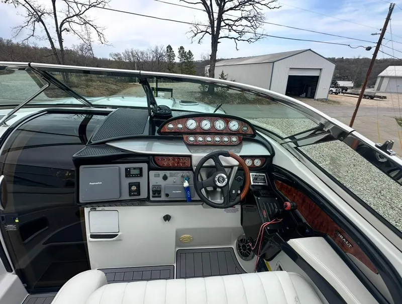 Slide: The Image of Interior of a 2005 Cobalt 360 boat, featuring a detailed dashboard and steering wheel. - 4
