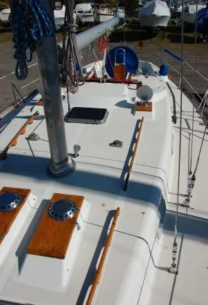 Slide: The Image of 1982 Tartan 37 sailboat deck with wooden accents and rigging. - 5