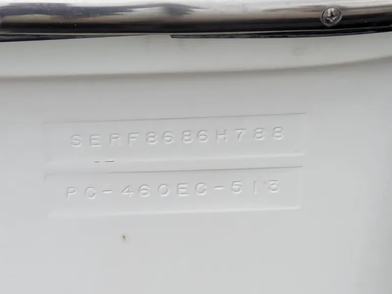 Slide: The Image of 1988 Sea Ray 460 Express Cruiser hull identification number on white surface. - 18