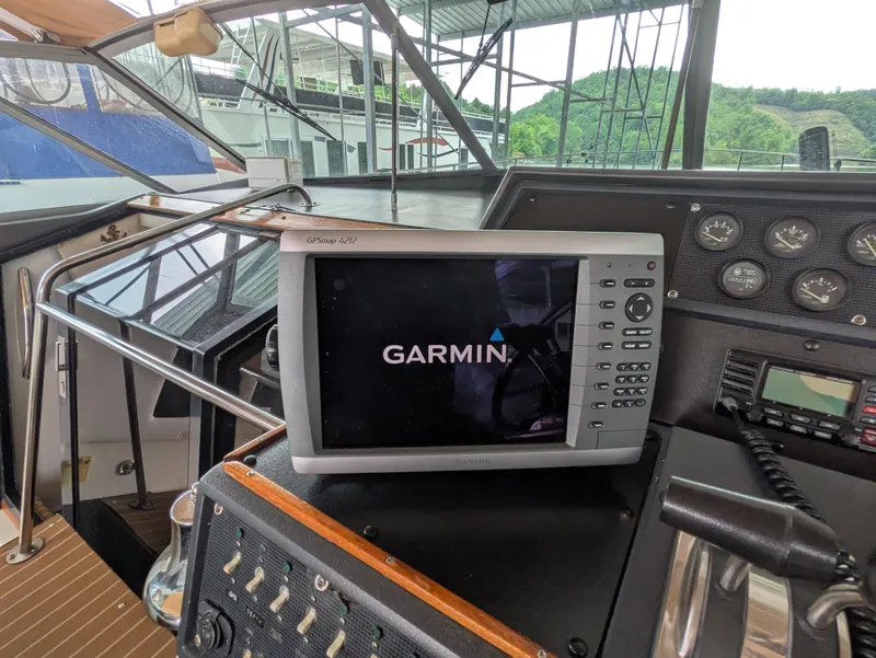 Slide: The Image of 1988 Sea Ray 460 Express Cruiser helm with Garmin navigation system. - 23