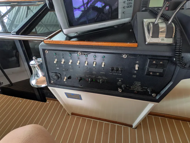 Slide: The Image of Control panel of a 1988 Sea Ray 460 Express Cruiser with navigation equipment. - 24