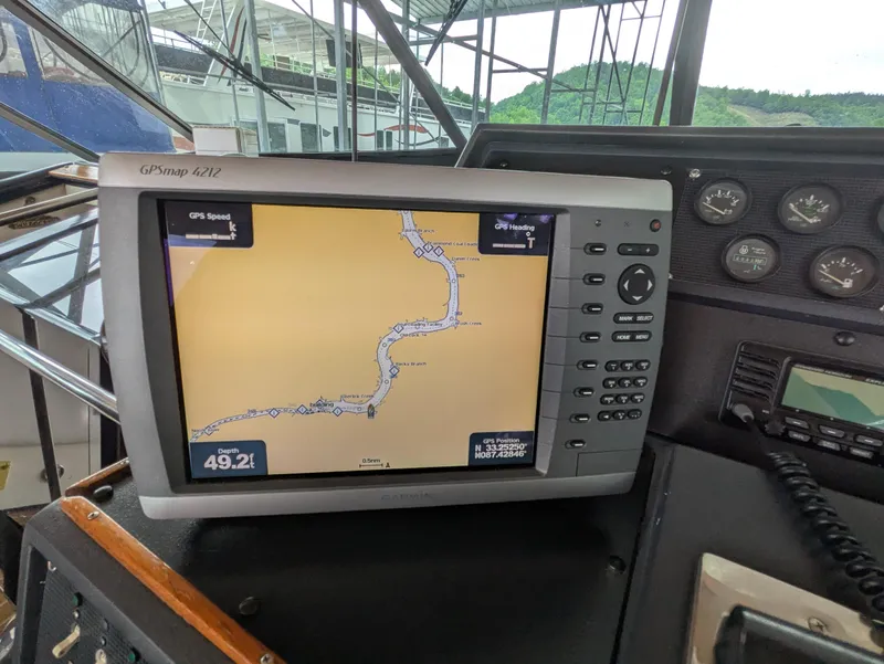 Slide: The Image of GPS navigation system on 1988 Sea Ray 460 Express Cruiser's dashboard. - 27