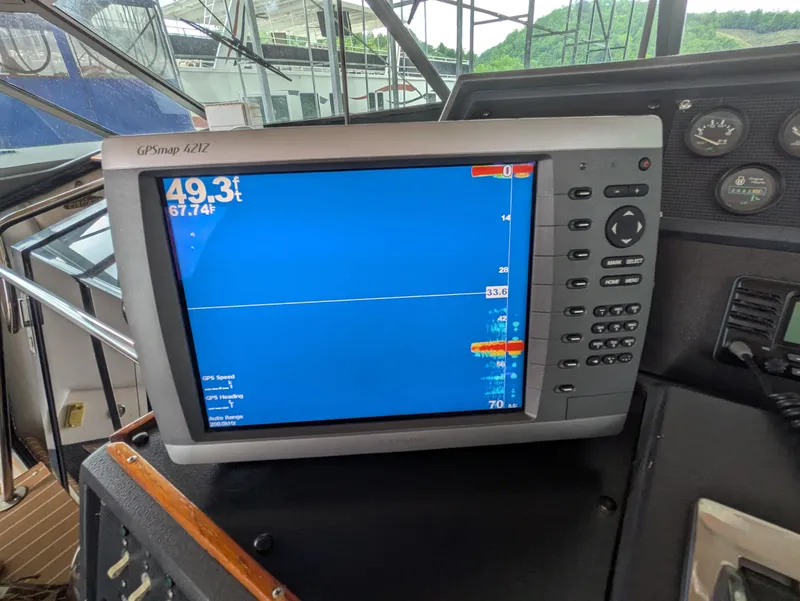 Slide: The Image of GPS display on 1988 Sea Ray 460 Express Cruiser showing depth and temperature. - 28