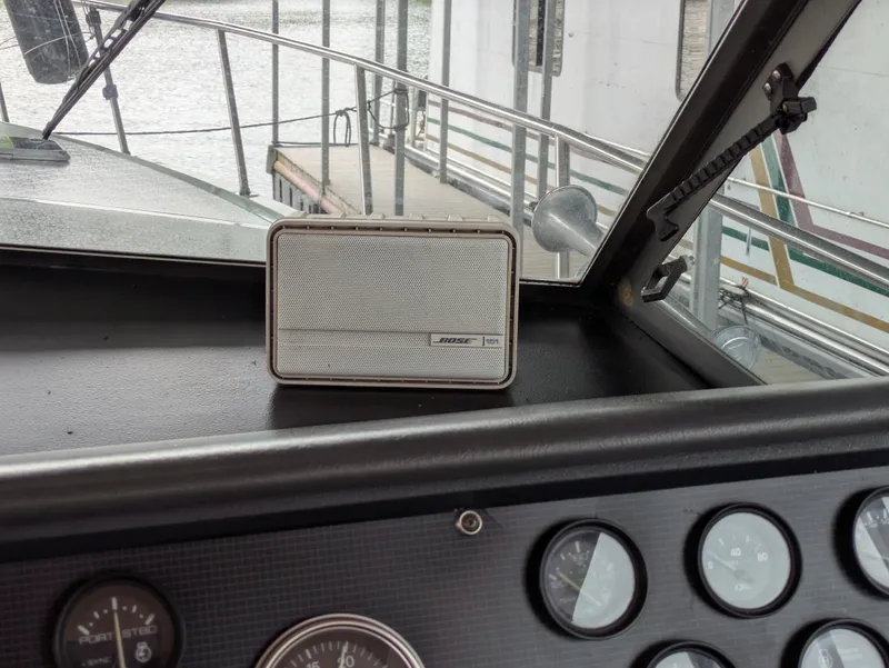 Slide: The Image of 1988 Sea Ray 460 Express Cruiser dashboard with Bose speaker and instrument panel. - 29