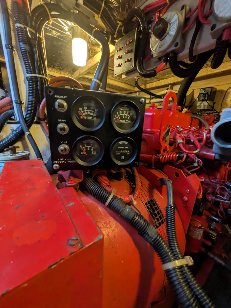 Slide: The Image of Engine room of 1988 Sea Ray 460 Express Cruiser with gauges and wiring. - 32