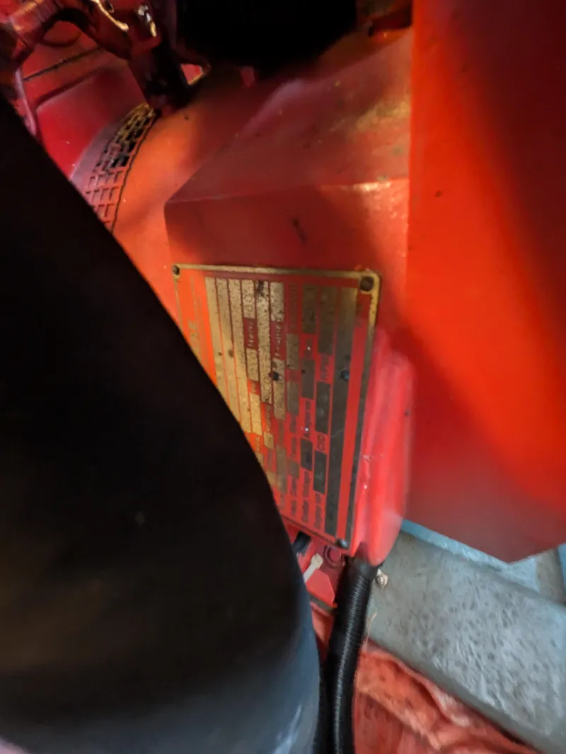 Slide: The Image of Close-up of a 1988 Sea Ray 460 Express Cruiser engine component with a metal identification plate. - 33