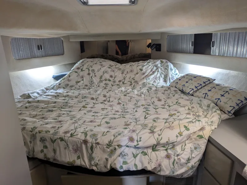 Slide: The Image of Cozy cabin interior of 1988 Sea Ray 460 Express Cruiser with floral bedding. - 40