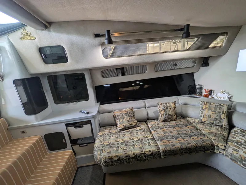 Slide: The Image of Interior of 1988 Sea Ray 460 Express Cruiser with patterned seating and modern design. - 49