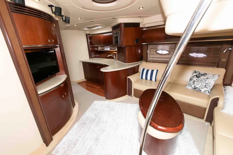Slide: The Image of Luxurious interior of 2005 Sea Ray 500 Sundancer yacht with elegant wood finishes. - 17