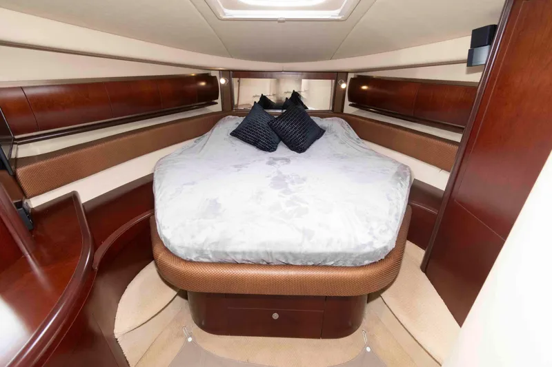 Slide: The Image of Luxurious cabin interior of 2005 Sea Ray 500 Sundancer yacht with elegant bedding. - 21