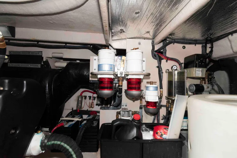 Slide: The Image of Engine room of 2005 Sea Ray 500 Sundancer with filters and equipment. - 29